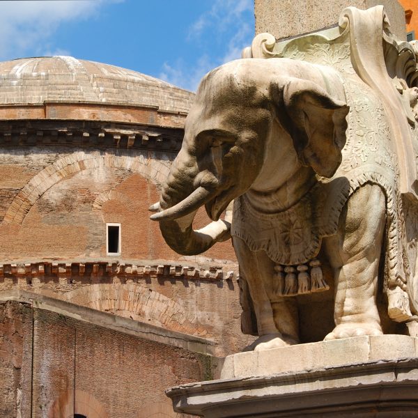 Photo of Bernini's sculpture of an elephant, in Piazza Minerva, Rome, with the Pantheon on the background.